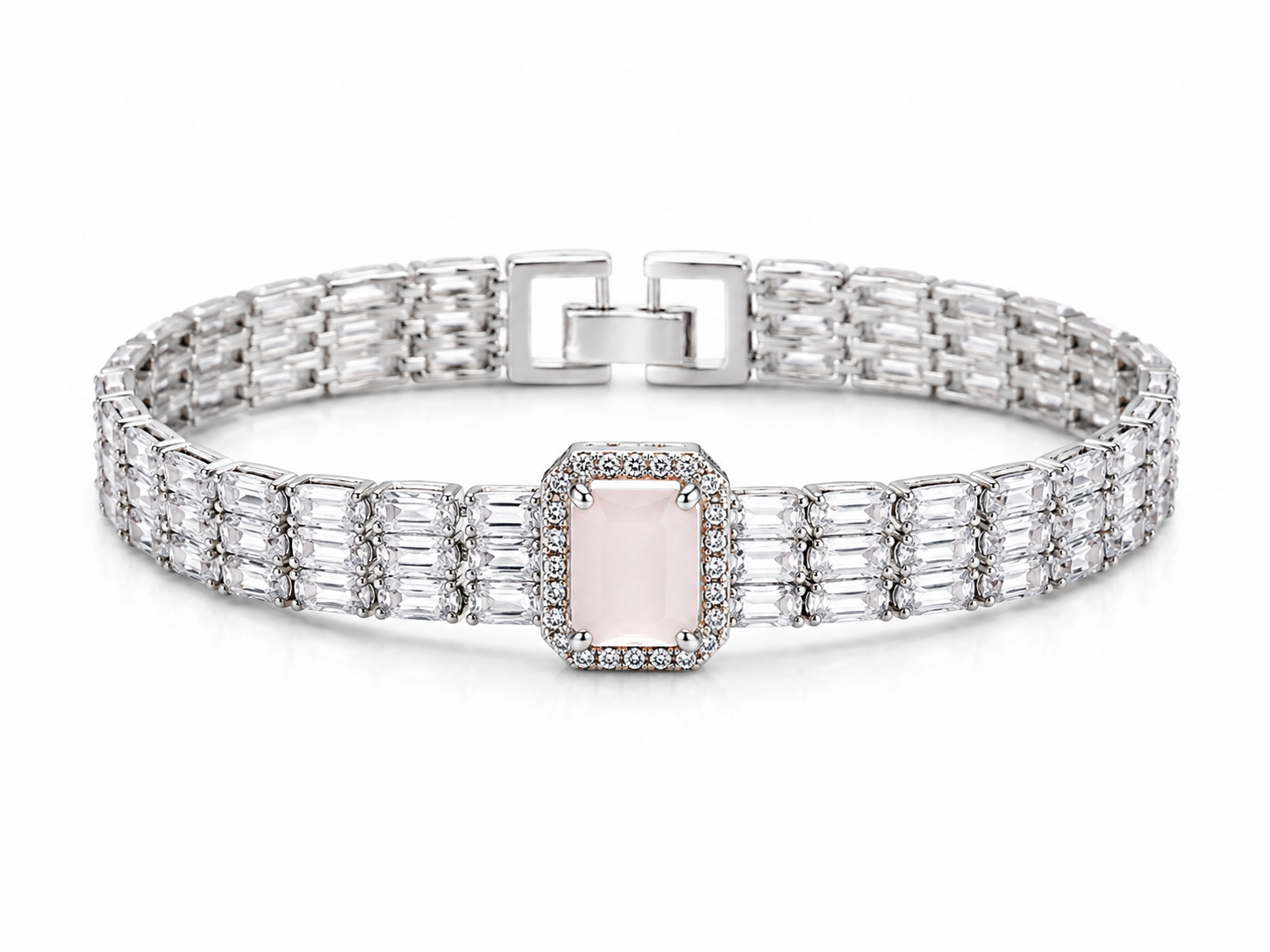 A silver-toned link bracelet featuring a central rectangular pale pink gemstone surrounded by small clear stones, with baguette-cut side stones and a square clasp, shown on a white background.
