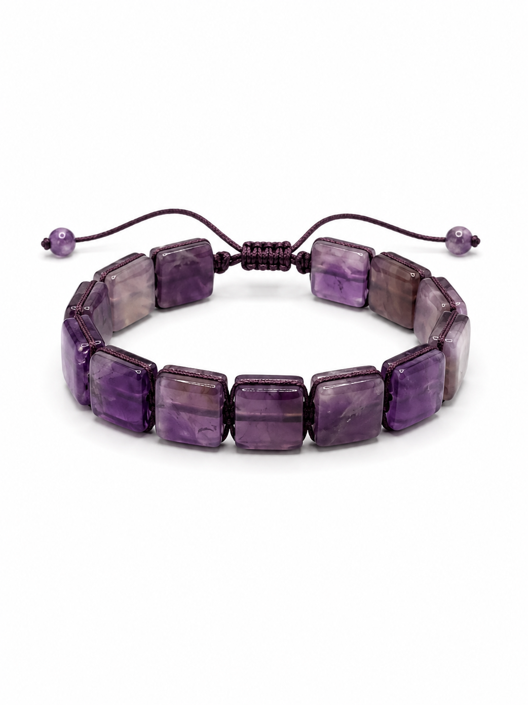 A beaded stretch bracelet made of polished purple amethyst rectangular beads, featuring a dark brown adjustable cord with small purple beads at the ends, shown on a plain white background.