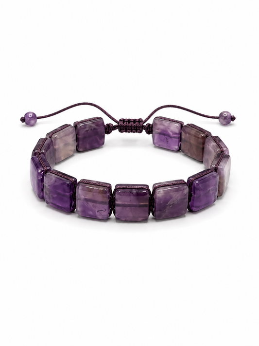 A beaded stretch bracelet made of polished purple amethyst rectangular beads, featuring a dark brown adjustable cord with small purple beads at the ends, shown on a plain white background.