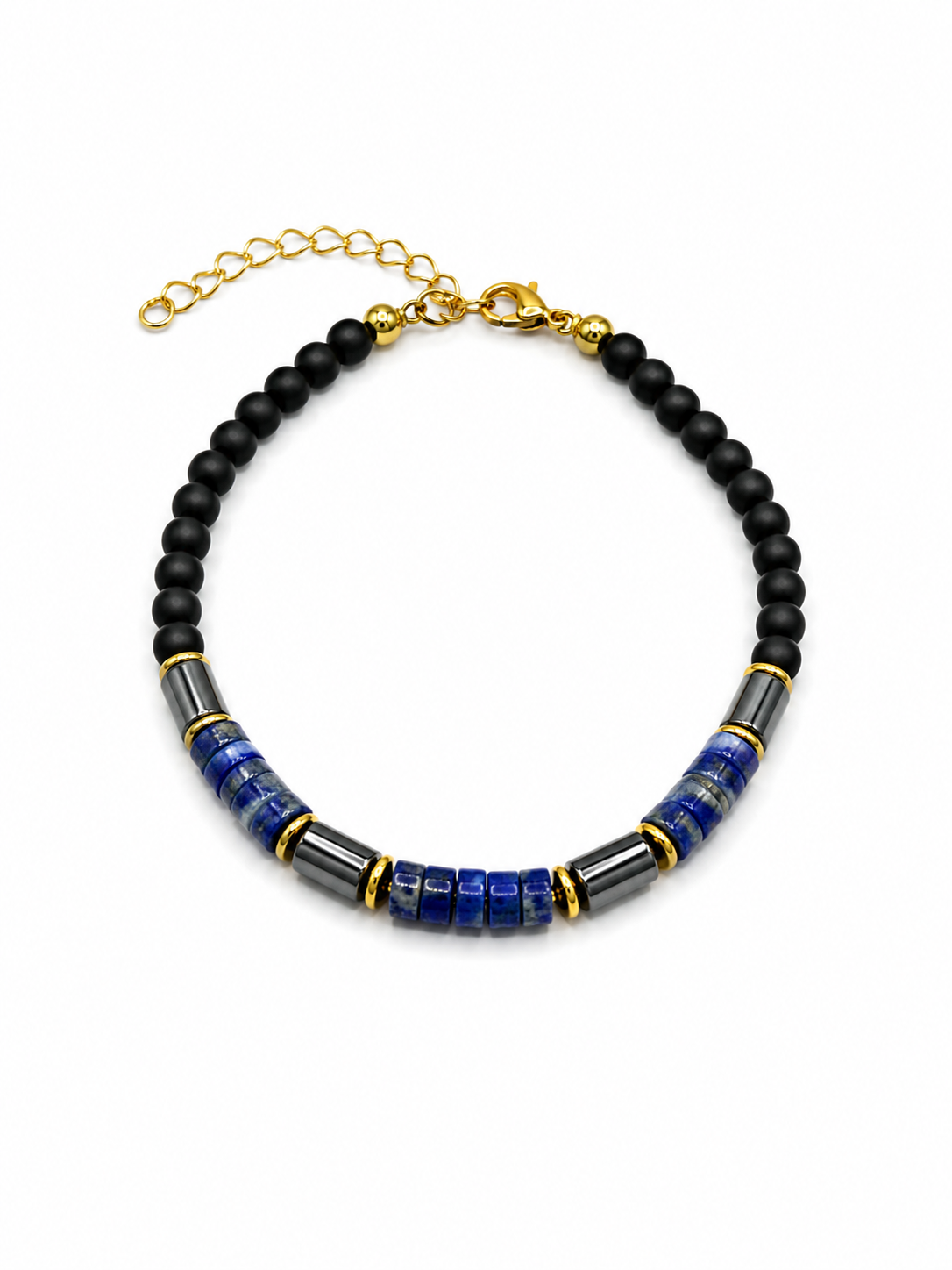 A beaded necklace featuring matte black round beads, textured blue cylindrical beads, and polished dark gray spacer beads, accented with gold-toned metal rings and a gold chain extender with clasp, shown on a plain white background.