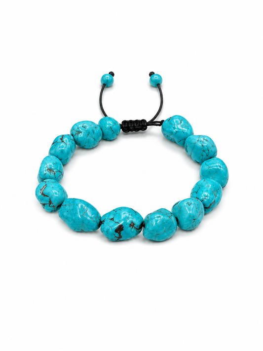 A turquoise beaded bracelet with irregular, polished beads and a black adjustable cord closure, displayed on a clean white background.
