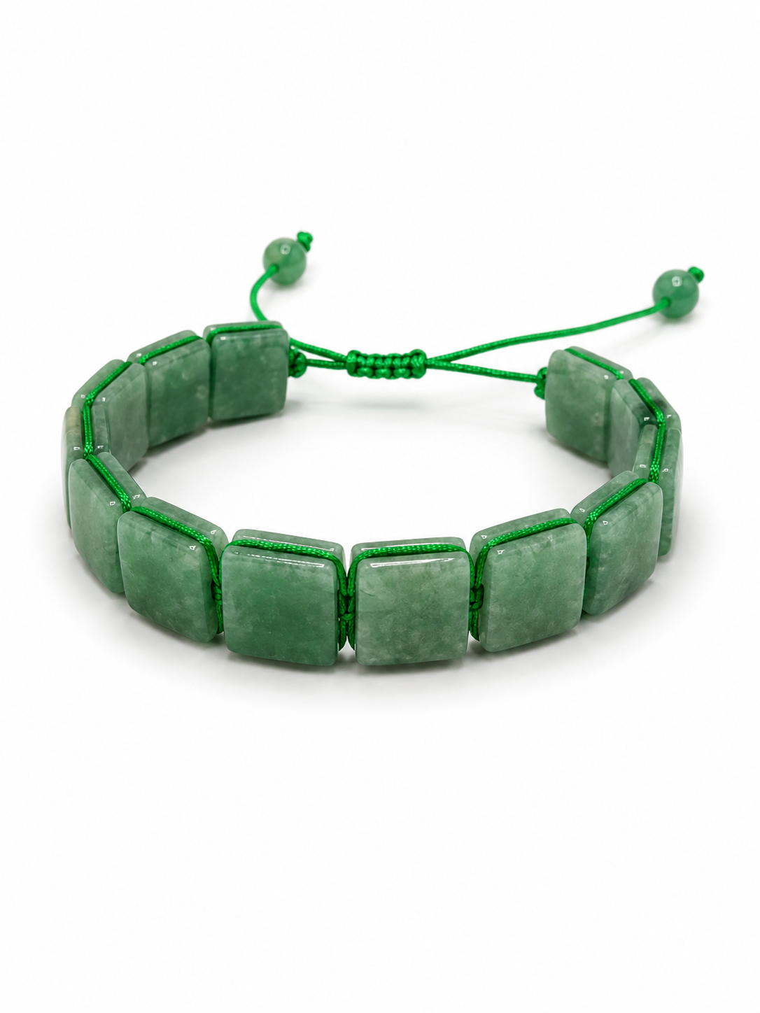 A green beaded stretch bracelet made of rectangular stone beads, tied with a matching green cord and adjustable sliding knot, shown on a white background.