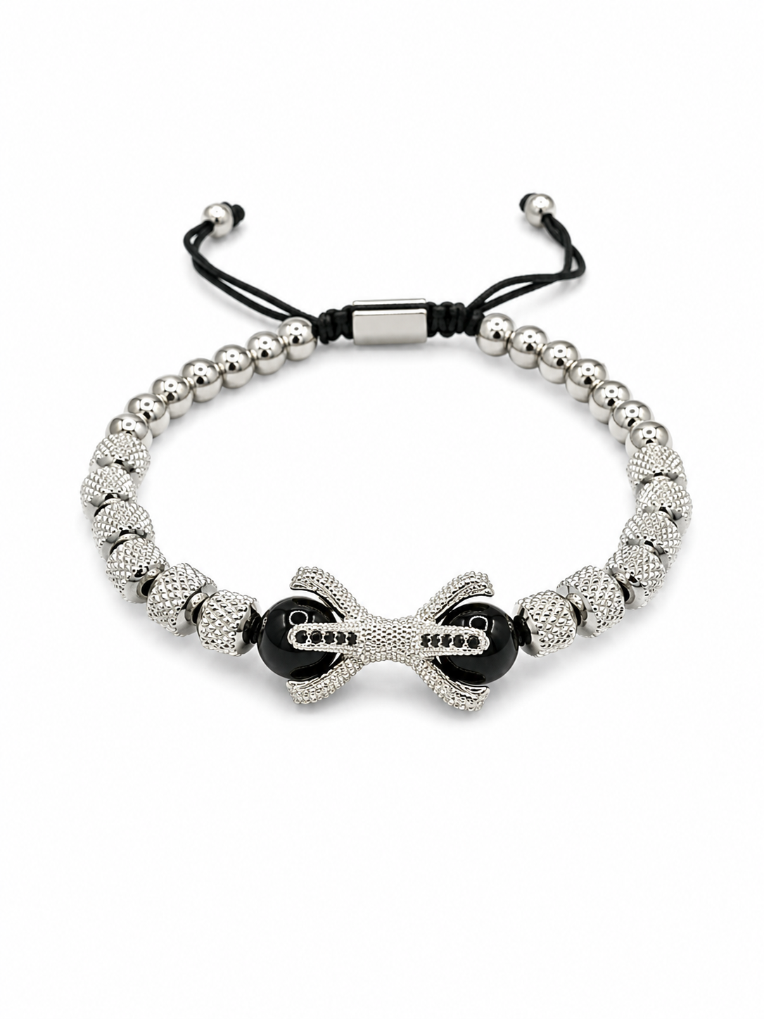 A silver beaded bracelet with a central bow-shaped charm, black beads, and a black adjustable cord closure, shown on a plain white background.