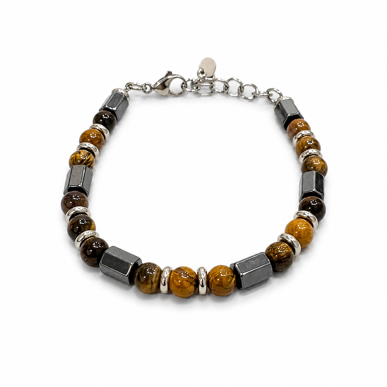 A beaded bracelet featuring round and faceted brown tiger's eye beads, dark gray rectangular magnetite beads, and polished silver spacer beads, completed with a silver lobster clasp on a white background.