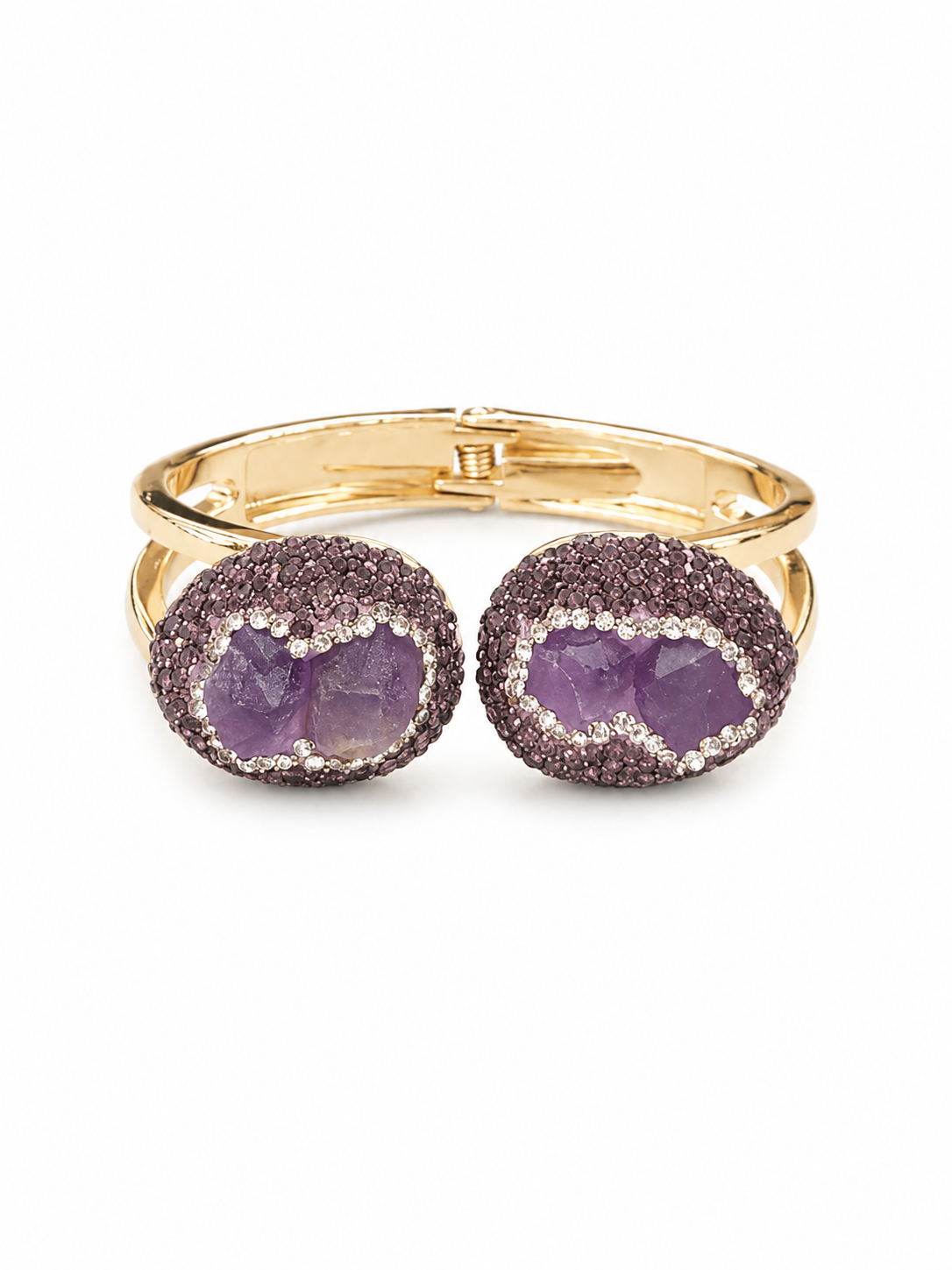 A gold-tone cuff bracelet featuring two oval bezel-set amethyst crystal clusters surrounded by pavé diamonds, shown on a plain white background.