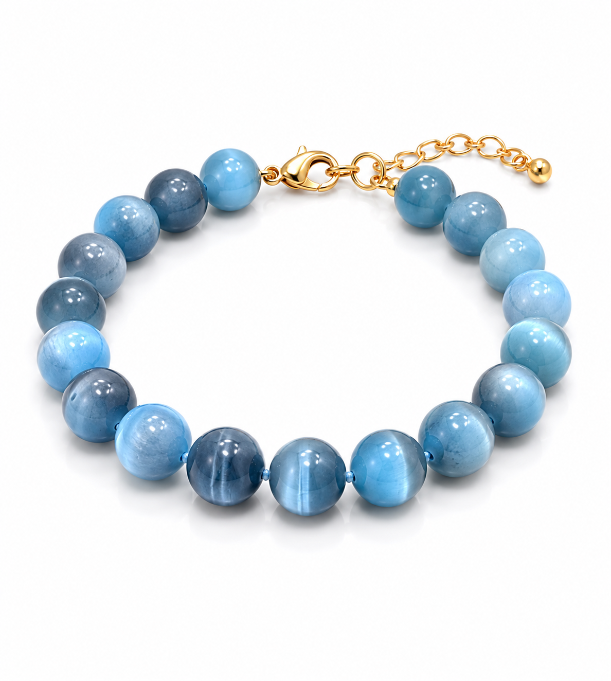 A beaded bracelet made of round light blue and medium blue polished beads with a gold clasp and extension chain, shown on a clean white background.