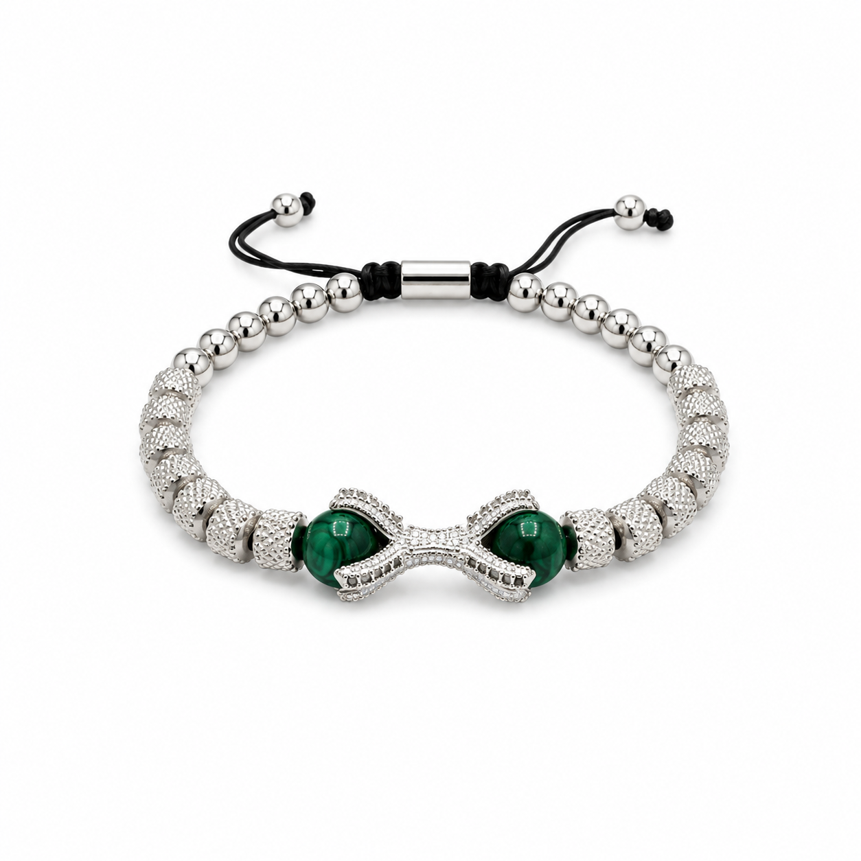 A silver beaded bracelet with a central infinity-shaped charm paved with small clear stones, featuring two green oval inlays, adjustable black cord closure, and silver metal beads on a white background.