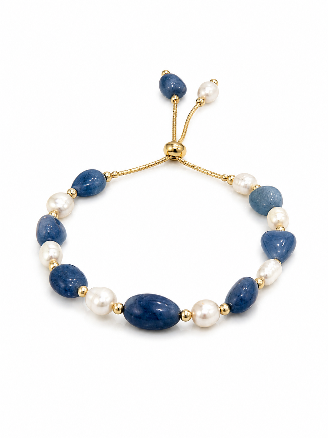 A beaded stretch bracelet featuring polished navy blue stones, white freshwater pearls, and gold-toned metal spacers and adjustable cord, shown on a plain white background.