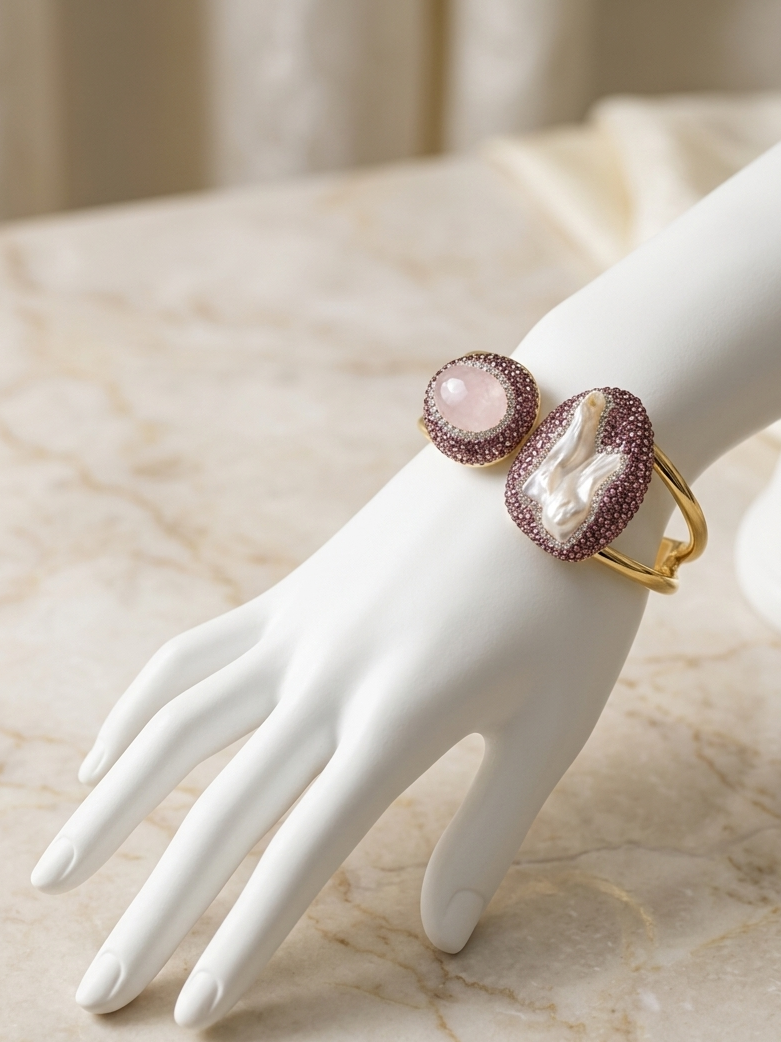 Natural Rose Quartz & Mother of Pearl Open Cuff Bracelet displayed on a luxury white ceramic hand, featuring genuine Rose Quartz, Mother of Pearl, sparkling pavé detailing, and Gold PVD-Plated (Non-Tarnish) craftsmanship.