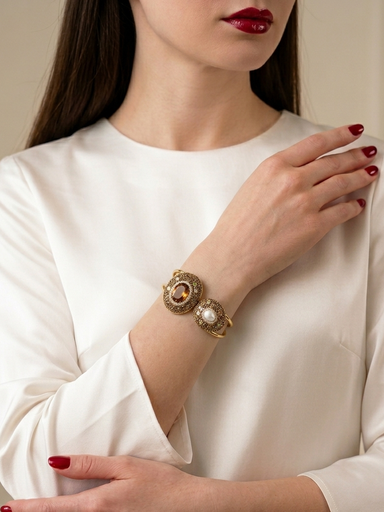 Female model wearing the Imperial Citrine & Pearl Mosaic Luxe Cuff Bracelet featuring Natural Citrine, Freshwater Pearl, multi-gemstone mosaic, pavé zircon accents, and Gold PVD-Plated (Non-Tarnish) finish.
