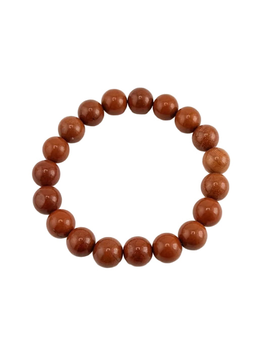 Brown beaded bracelet on a white background