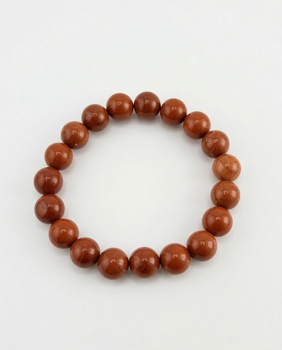 Brown beaded bracelet on a white background
