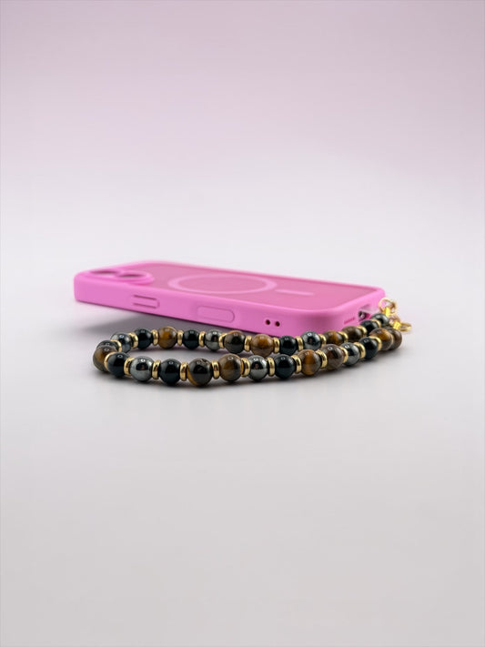 Pink phone case with a beaded chain on a light gray background