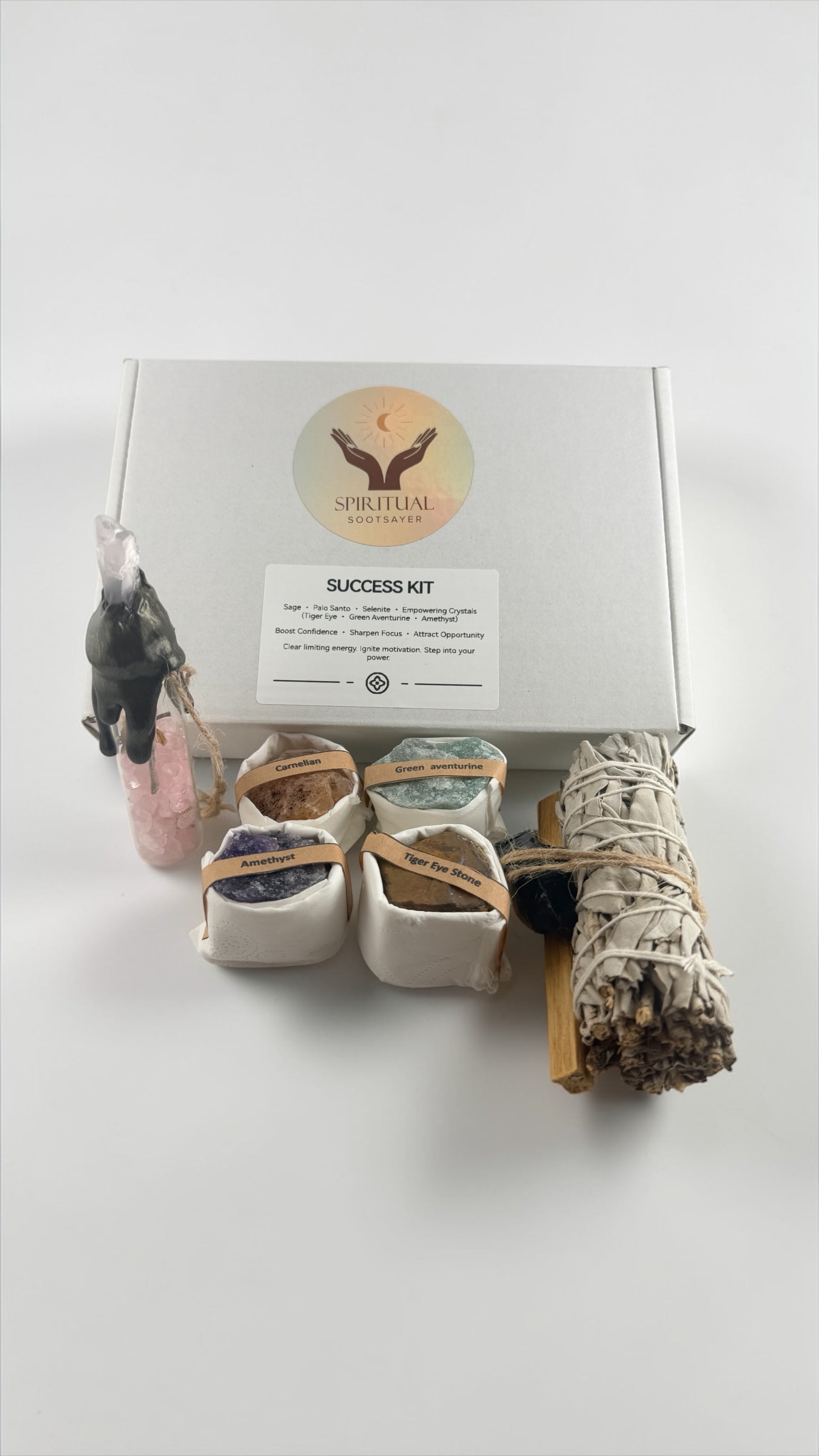 Success kit with items including a keychain, cards, and a bundle on a white background