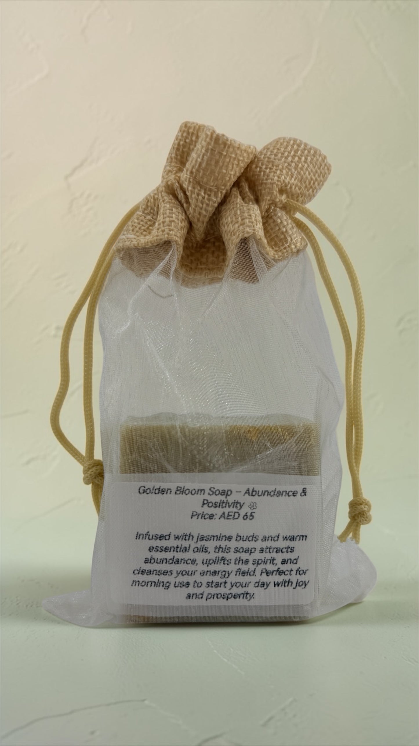 Bar of soap in a drawstring bag with text on a light background
