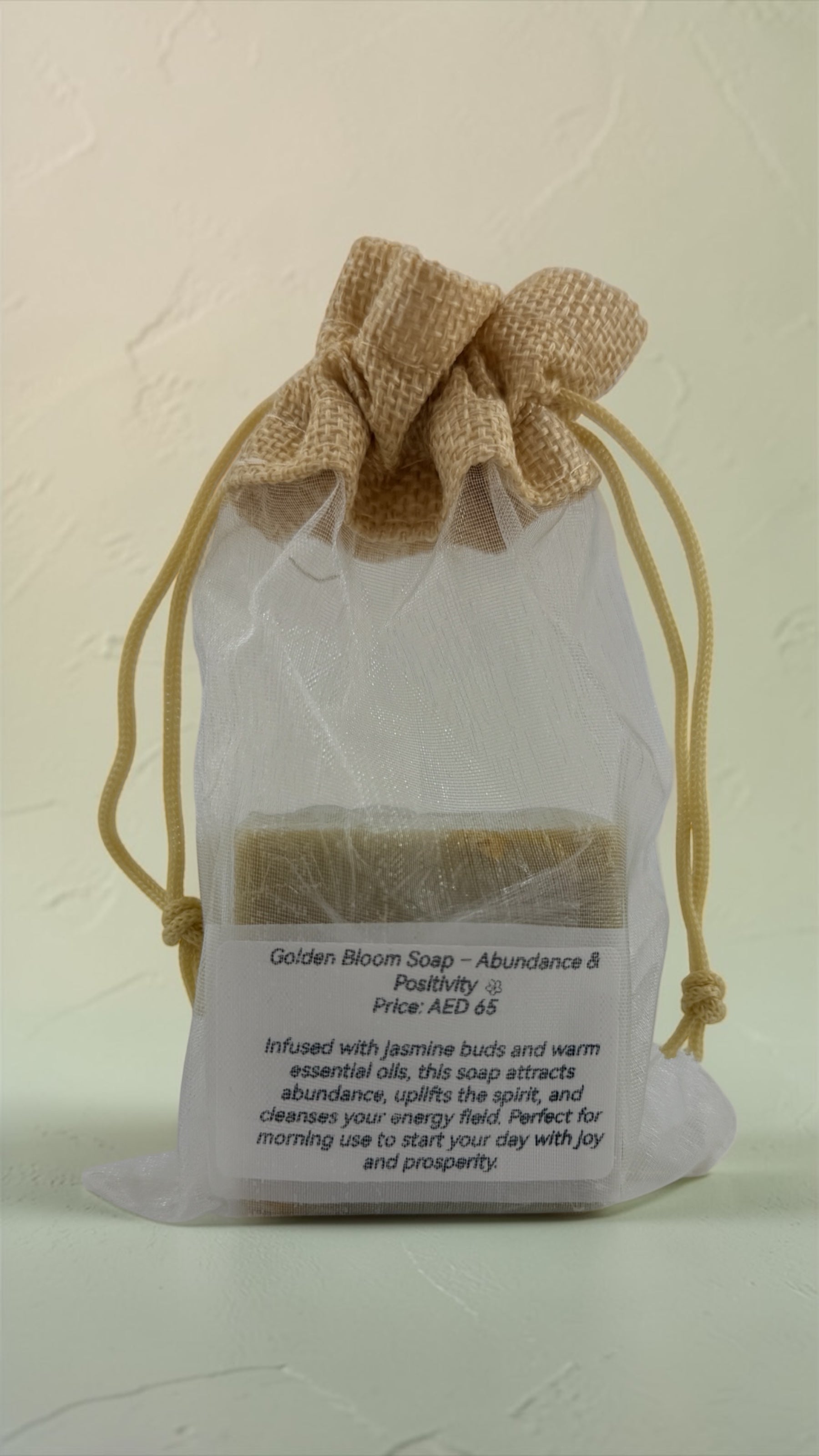 Bar of soap in a drawstring bag with text on a light background