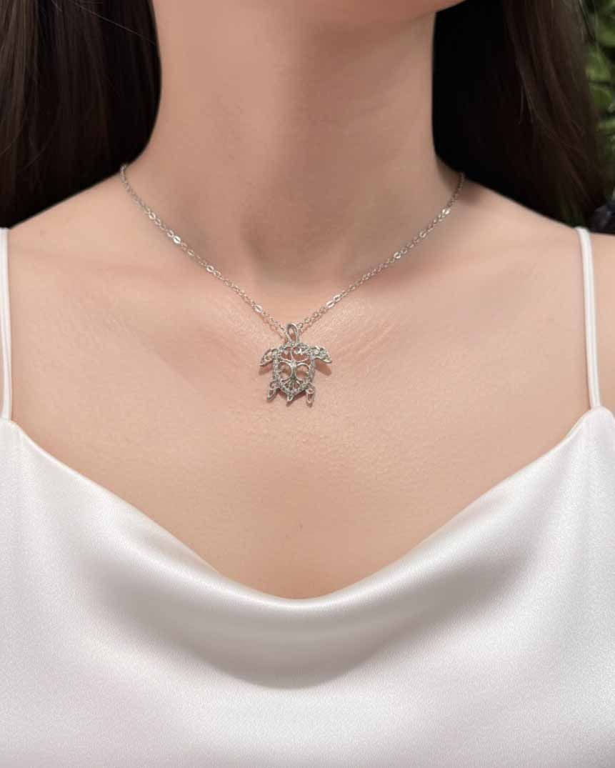Silver Turtle Pendant Necklace – elegant women’s sea turtle necklace in shimmering silver.