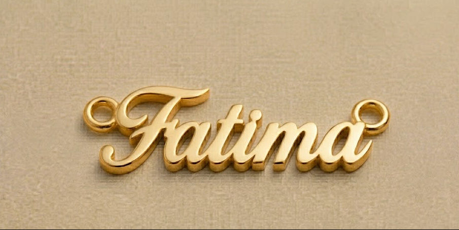 Gold 'Fatima' necklace pendant on a beige background