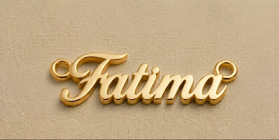 Gold 'Fatima' necklace pendant on a beige background