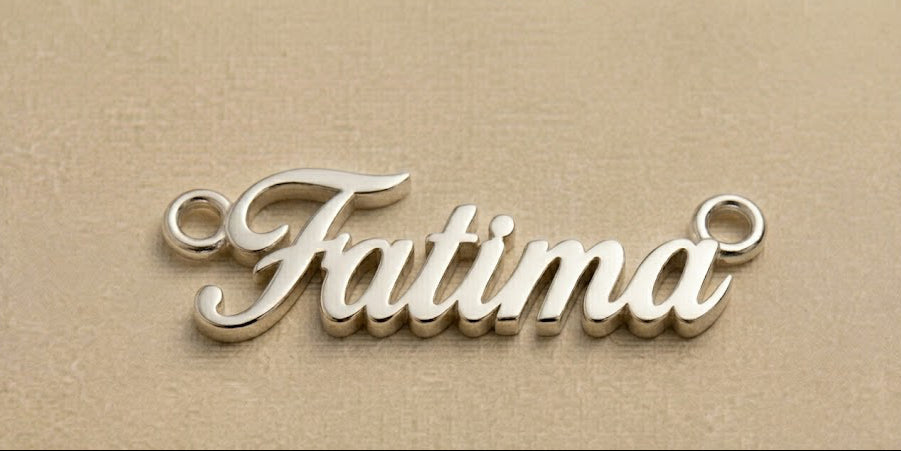 Silver 'Fatima' nameplate on a beige background