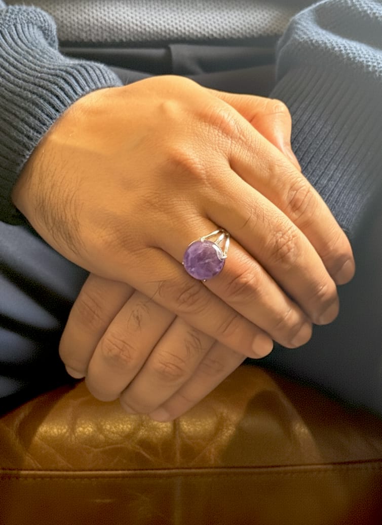 Amethyst gemstone ring worn with a casual outfit