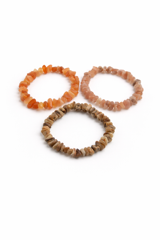 Three stone-look beaded bracelets on a white background