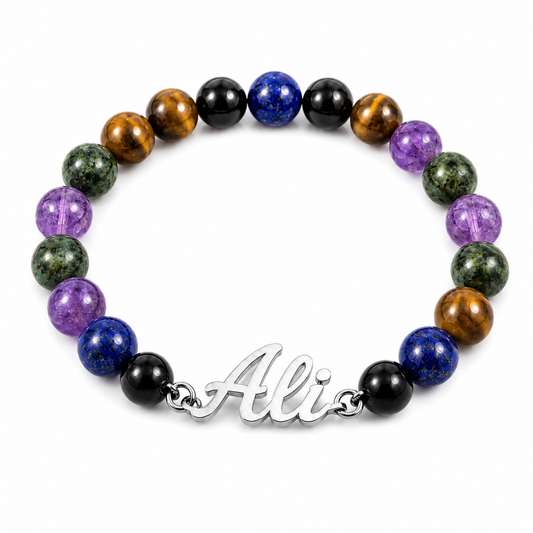 Multicolored beaded bracelet with a silver 'Ali' charm on a white background