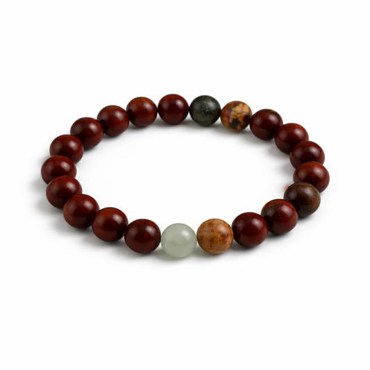 Bracelet with brown and green beads on a white background