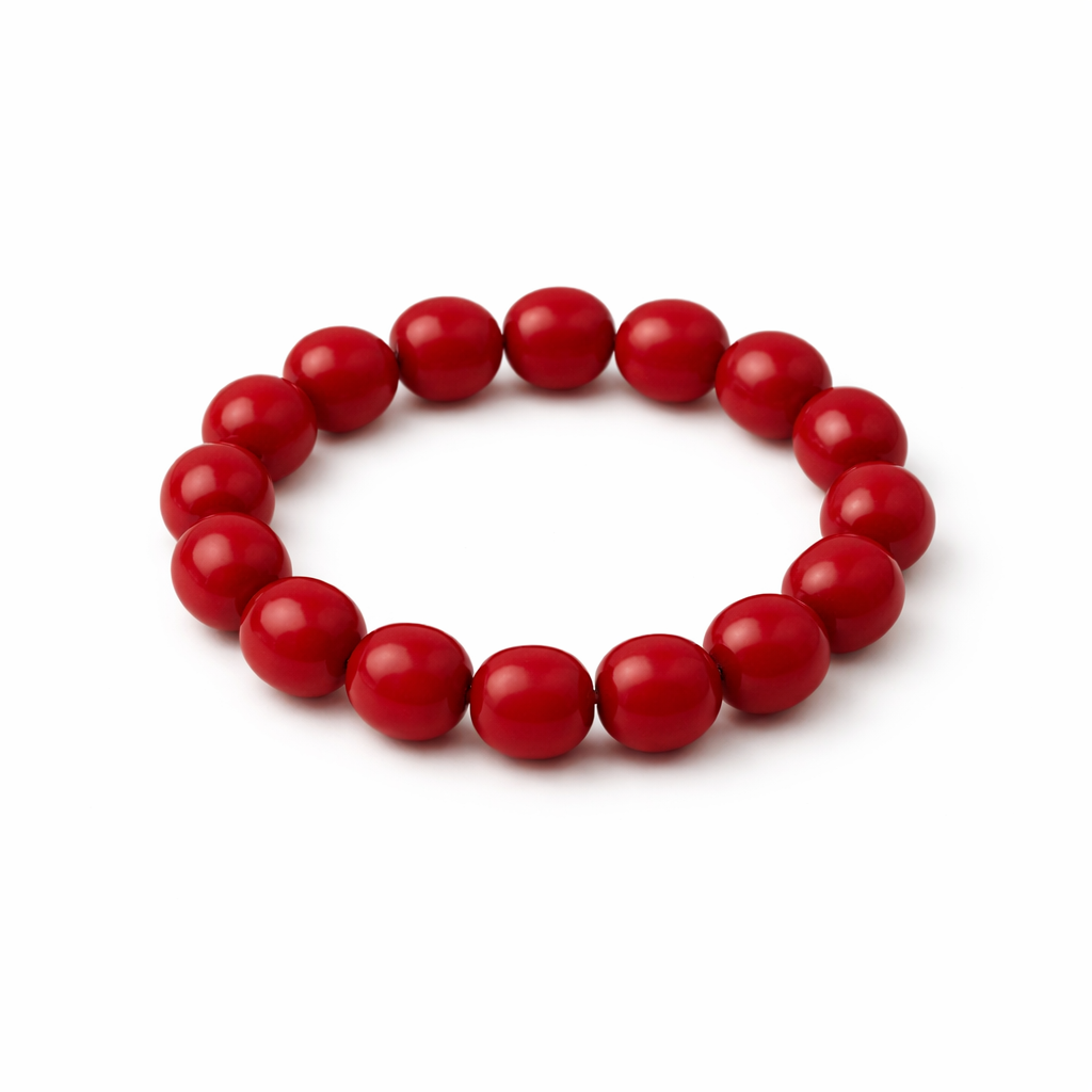 Red beaded bracelet on a white background