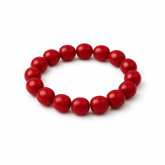 Red beaded bracelet on a white background