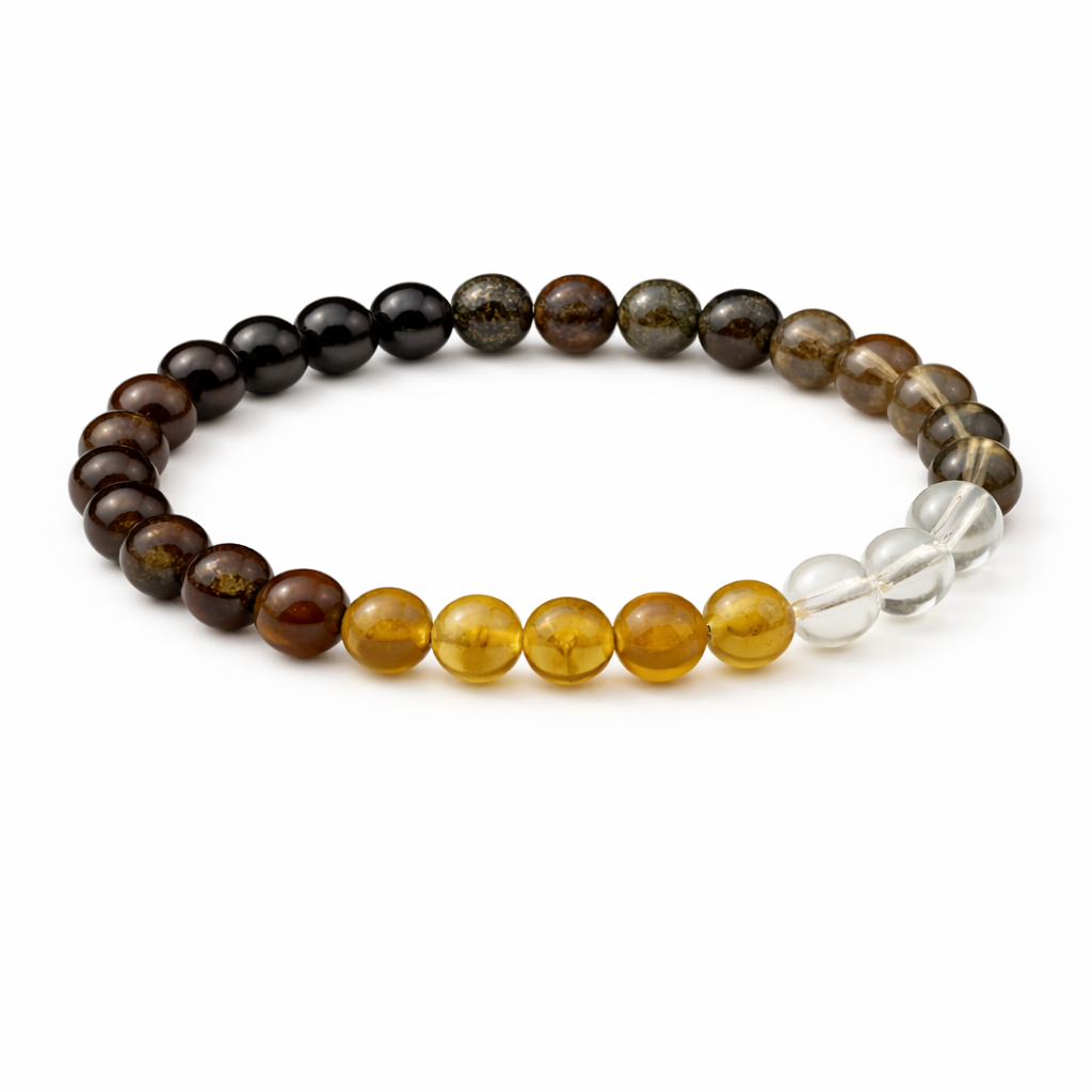 Beaded bracelet with brown, yellow, and clear beads on a white background