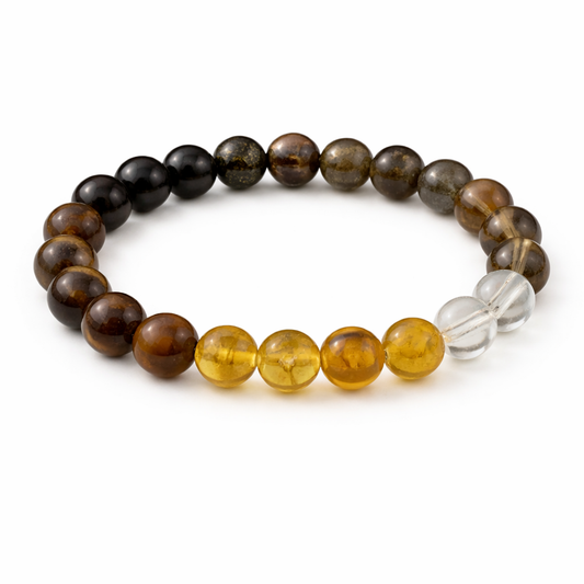 Beaded bracelet with brown, yellow, and clear beads on a white background
