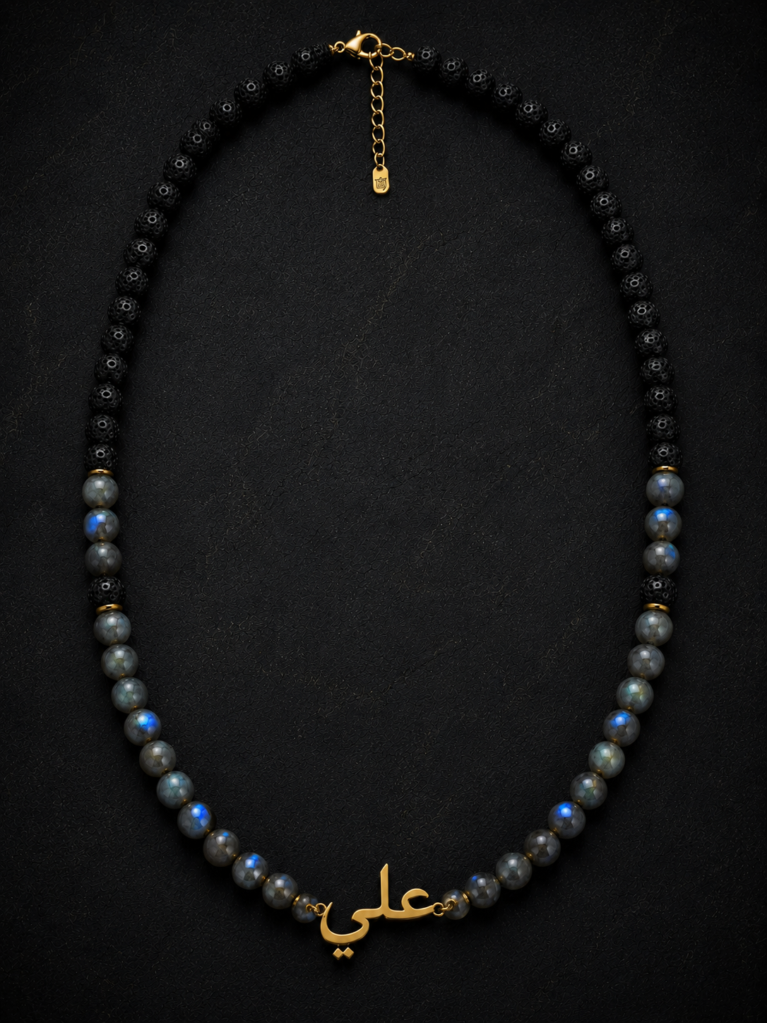 Necklace with black beads and gold accents on a dark background