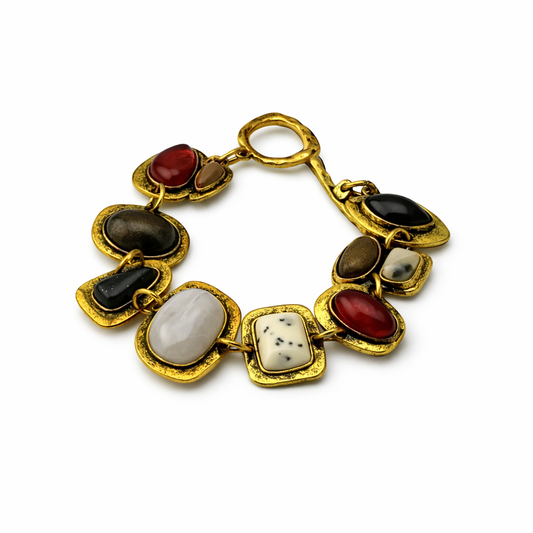 Gold necklace with multicolored stones on a white background