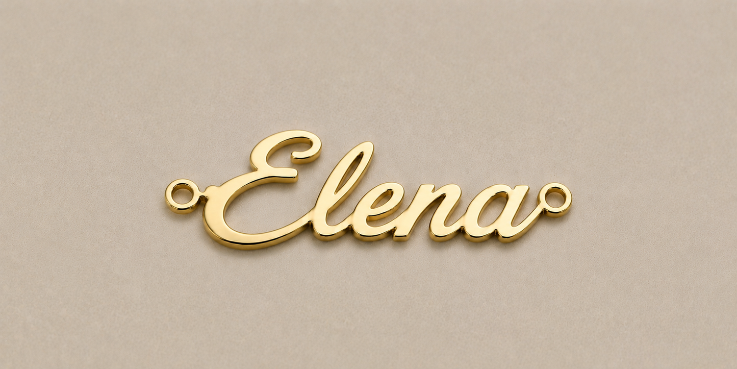 Gold name pendant with 'Elena' on a beige background