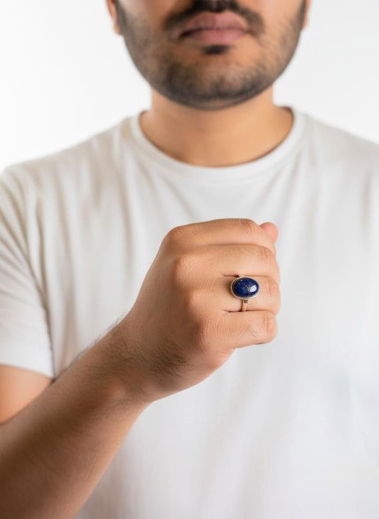 Man wearing rounded Lapis Lazuli ring in silver setting
