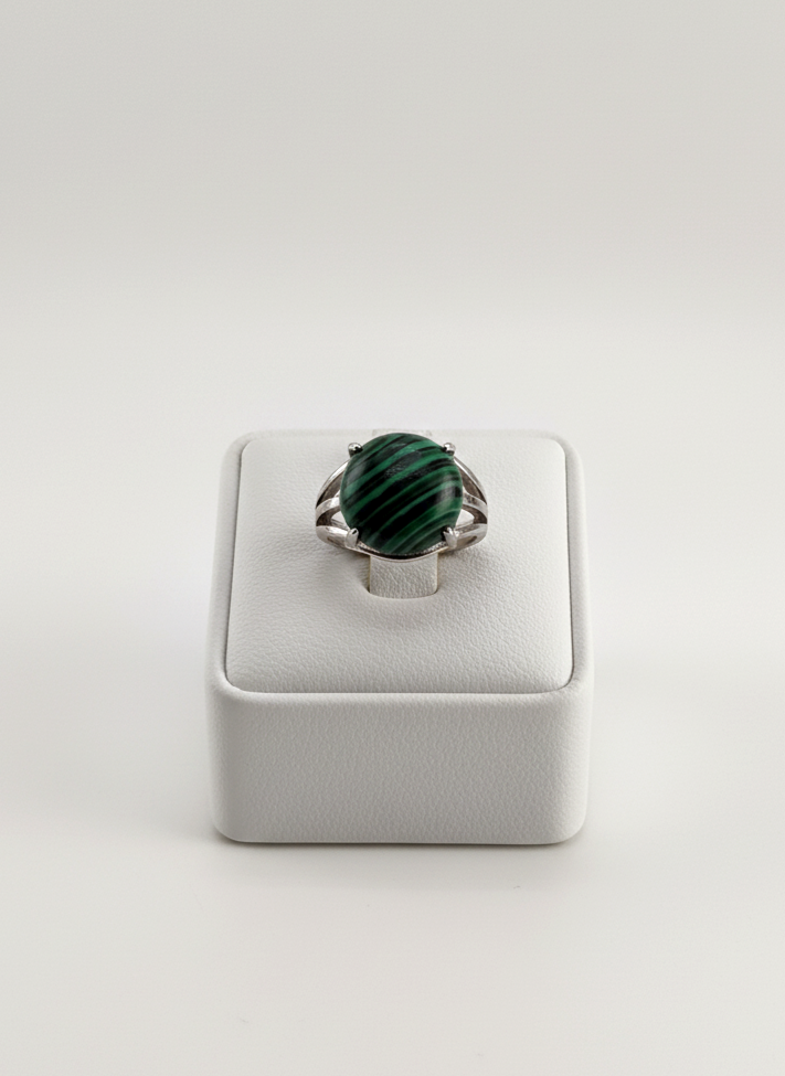 Male fashion photo showing a polished Malachite gemstone ring