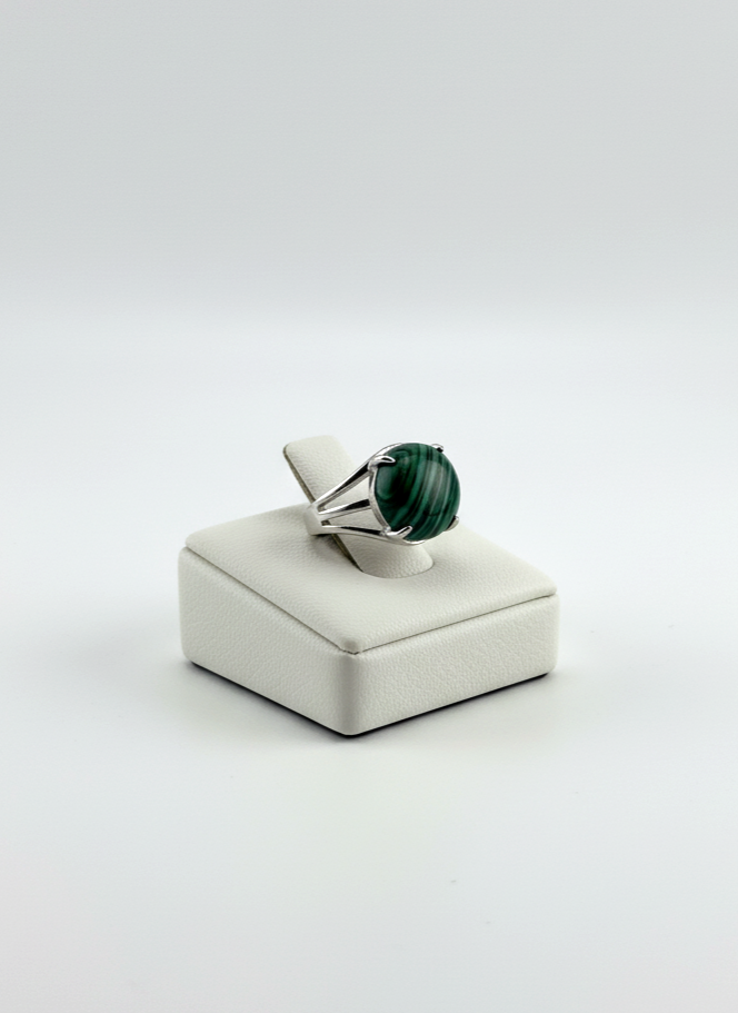 Male fashion photo showing a polished Malachite gemstone ring